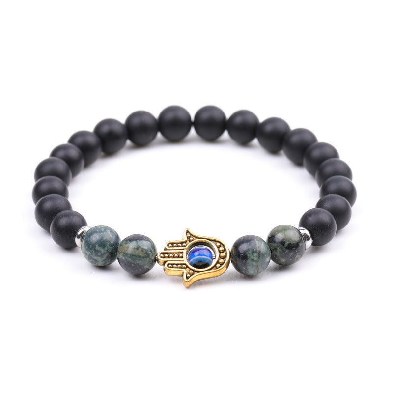 Pulseira de olho grego com penas de pavão