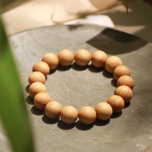 Thuja Wood Bracelet on Stone Table - KarmaBless